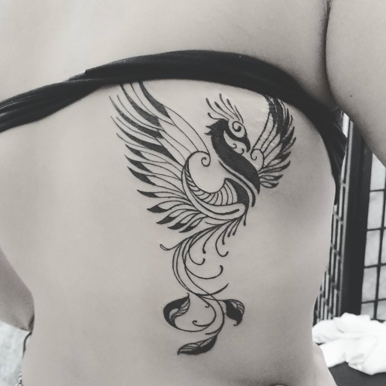 Cool Black Phoenix Tattoo On Girl Back