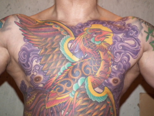 Cool Colorful Phoenix Tattoo On Man Chest