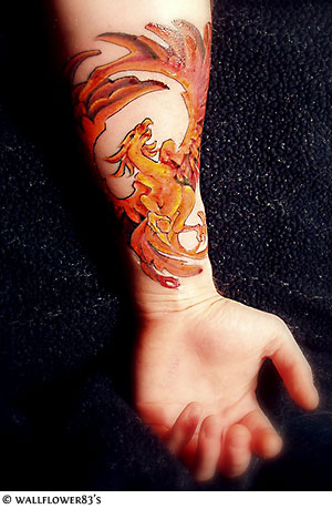 Cool Flaming Phoenix Tattoo On Left Forearm