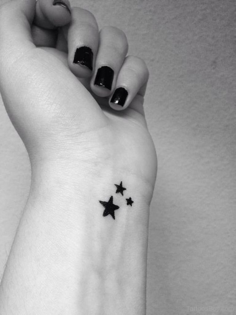 Cute Black Star Tattoo On Left Wrist