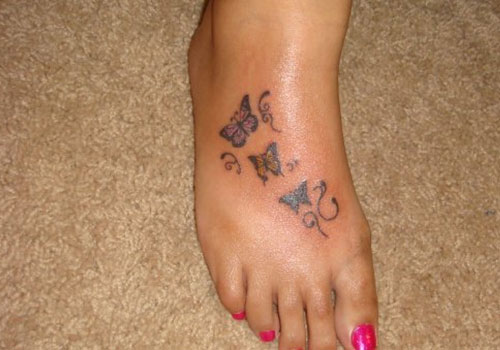 Cute Butterflies Tattoos On Girl Right Foot