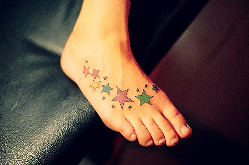Cute Colored Stars Tattoos On Right Foot