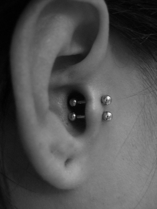 Dual Tragus Piercing With Silver Studs
