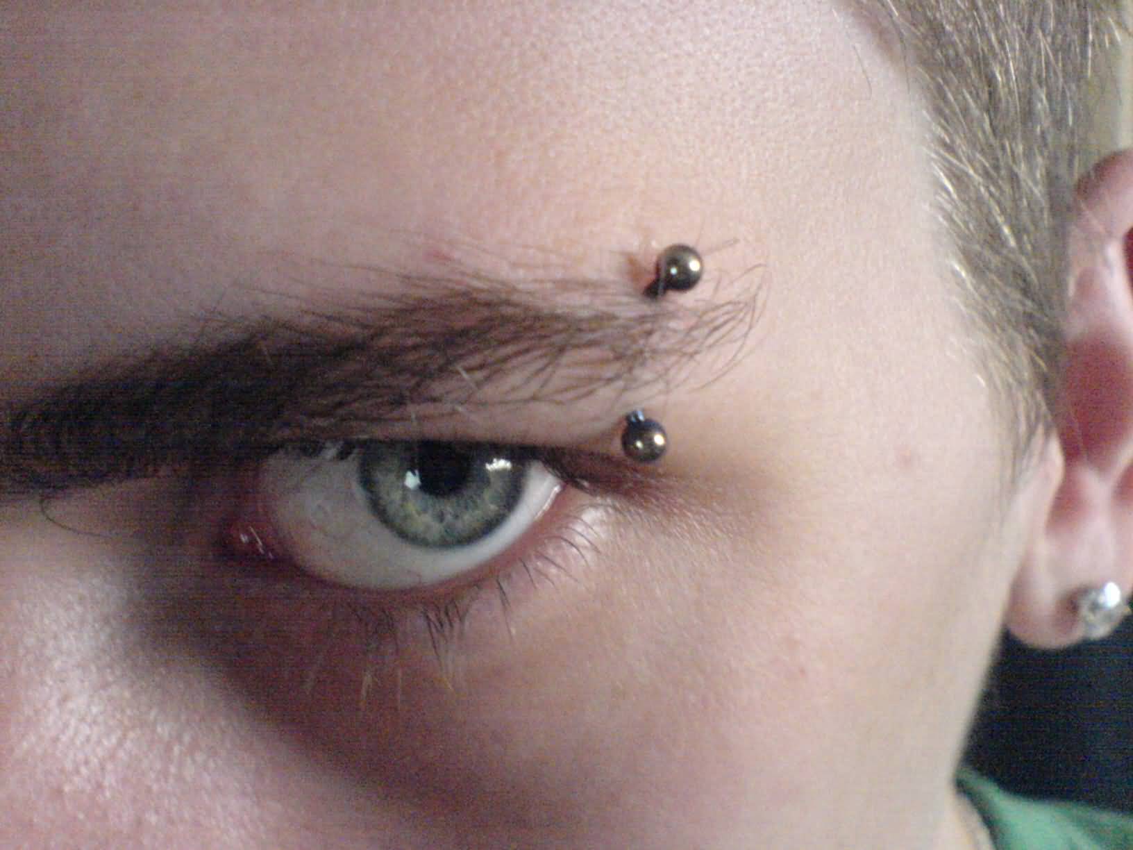 Eyebrow Piercing With Curved Barbell