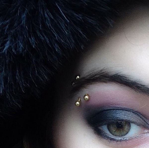 Eyebrow Piercing With Gold Barbells