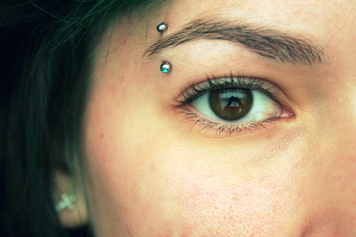 Eyebrow Piercing With Silver Barbell