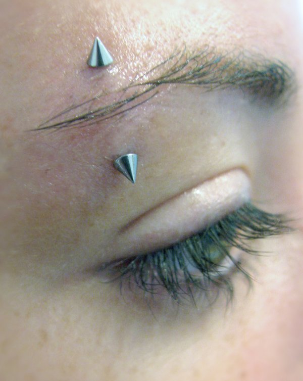 Eyebrow Piercing With Silver Spike Barbell