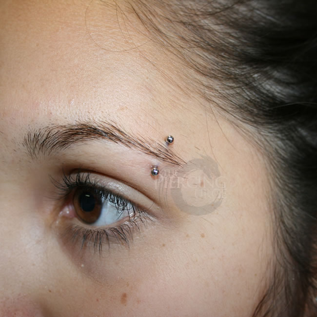 Eyebrow Piercing With Small Silver Barbell