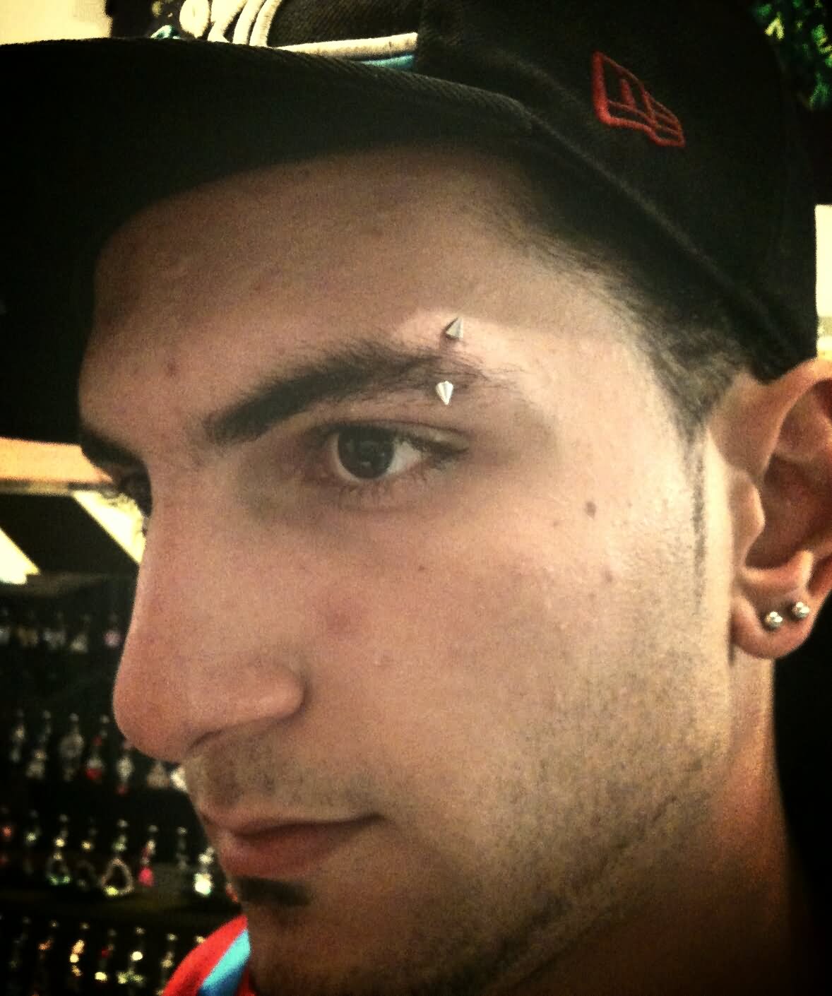 Eyebrow Piercing With Spike Barbell