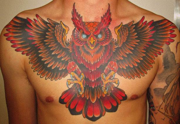 Flaming Owl Tattoo On Man Chest
