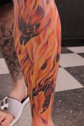 Flaming Phoenix Bird Tattoo On Left Leg