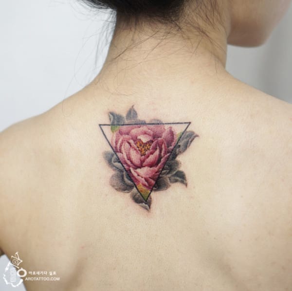 Flower In Upside Down Triangle Tattoo On Girl Upper Back