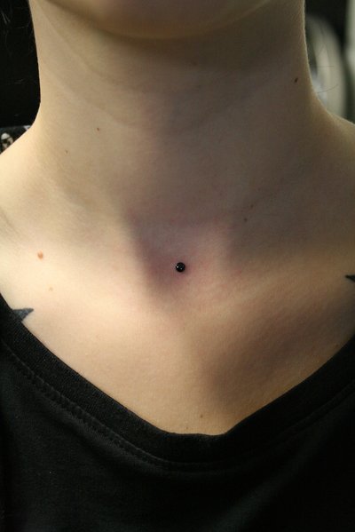 Front Neck Piercing With Black Stud