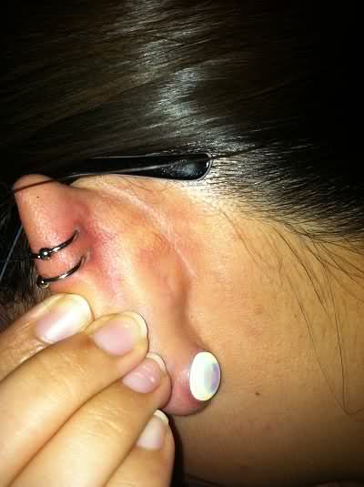 Gauge Lobe And Dual Helix Piercing With Rings