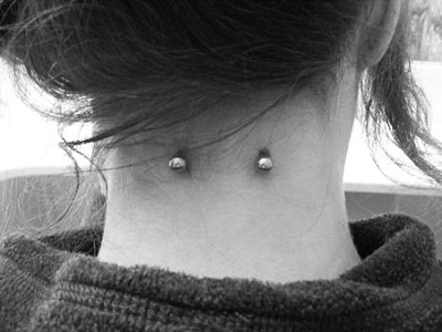 Girl Back Neck Piercing Picture