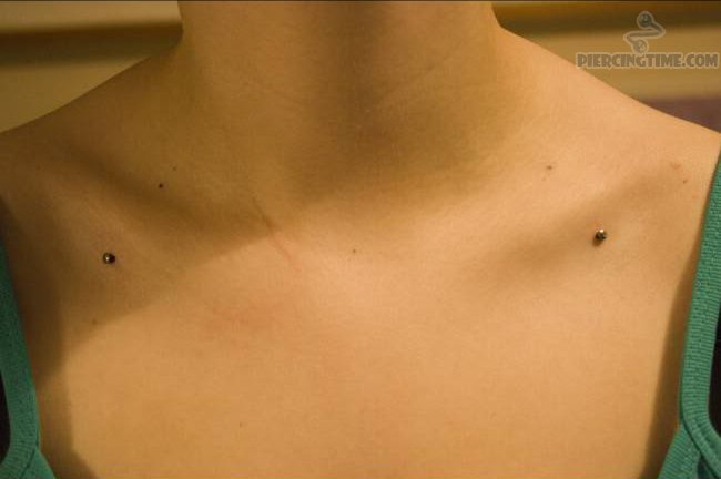 Girl Have Clavicle Piercing With Dermals