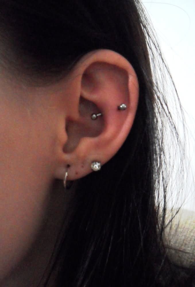 Girl Left Ear Snug Piercing With Curved Barbell
