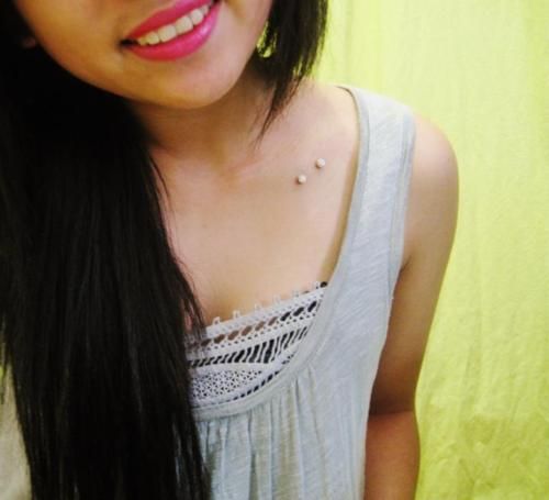 Girl With Left Clavicle Piercing