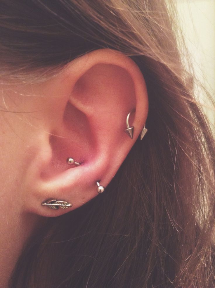 Girl With Left Ear Lobe and Snug Piercing With Spike Circular Barbell