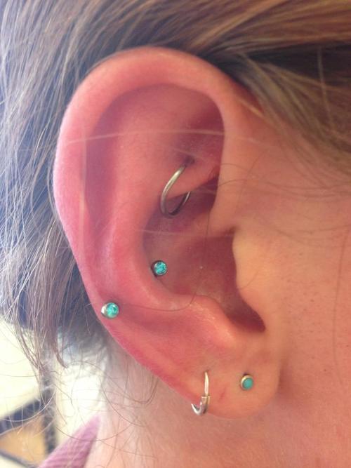 Girl With Lobe Piercing And Snug Piercing