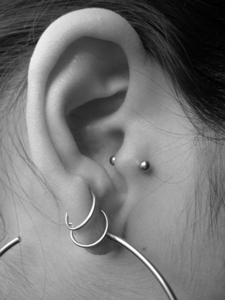 Girl With Right Ear Lobe and Tragus Piercing