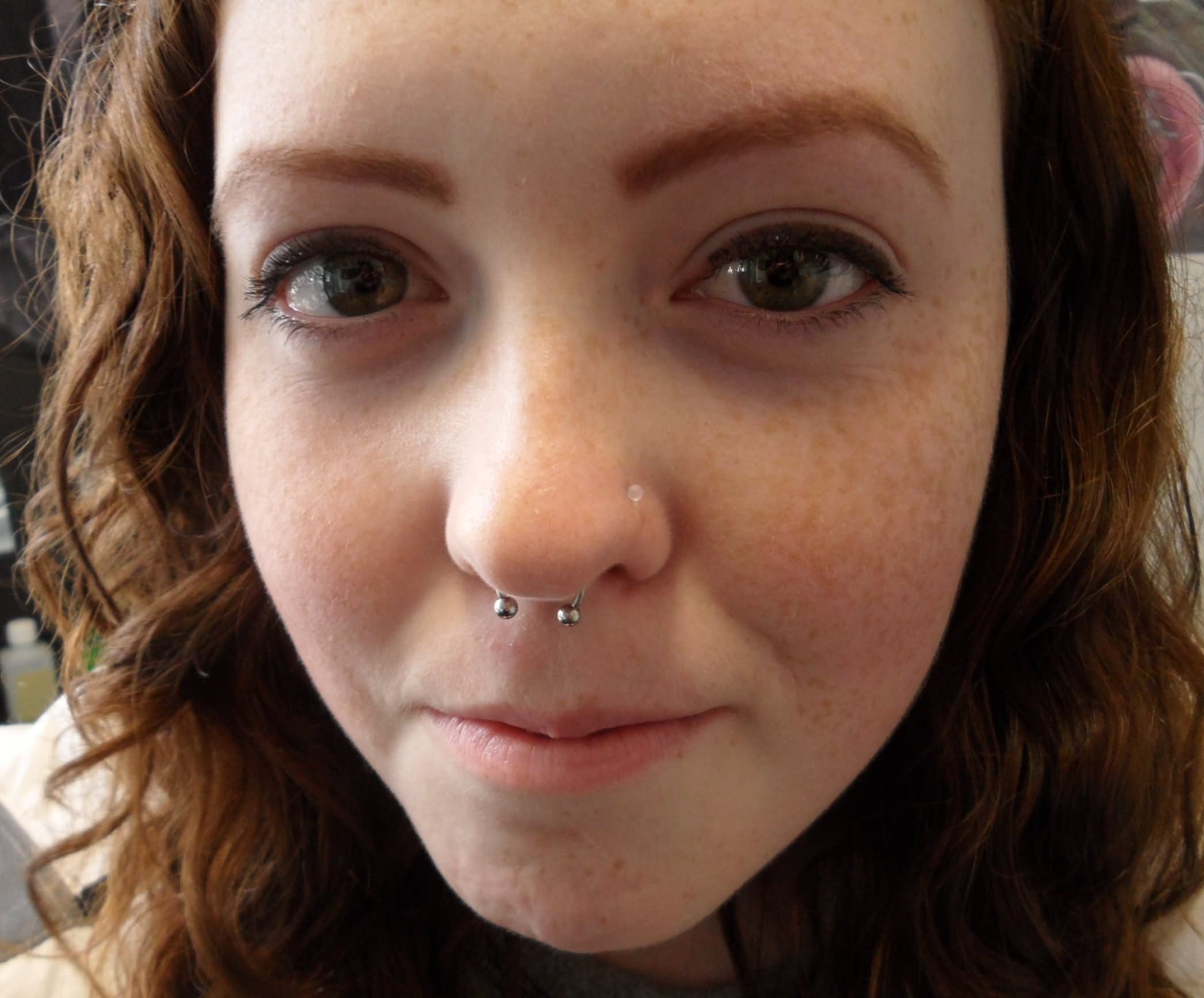 Girl With Septum Piercing With Ball Closure Ring
