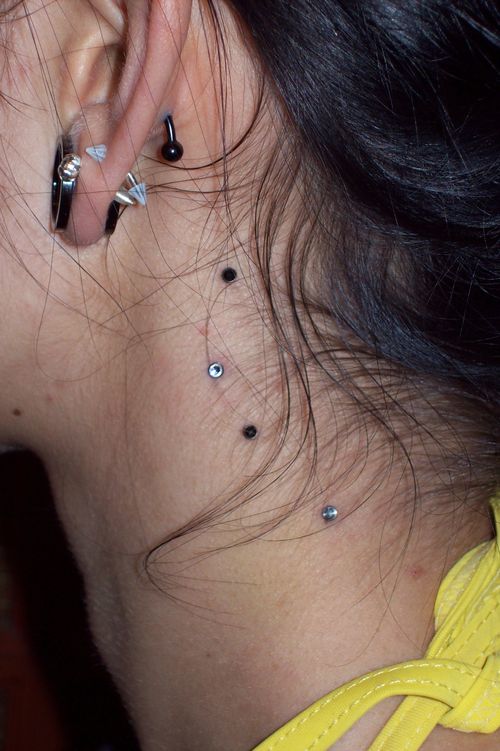 Girl With Side Neck Piercing With Dermal Anchors
