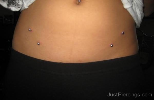 Girl With Surface Hip Piercings On Both Hips