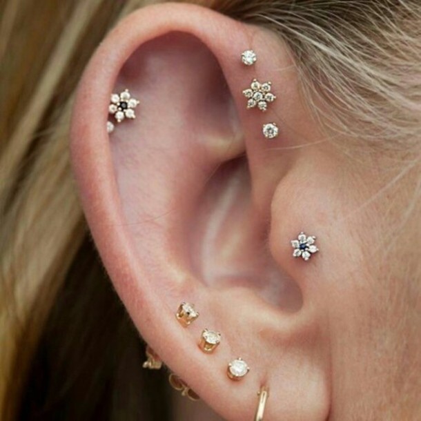 Girl With Triple Ear Lobes And Tragus Piercing