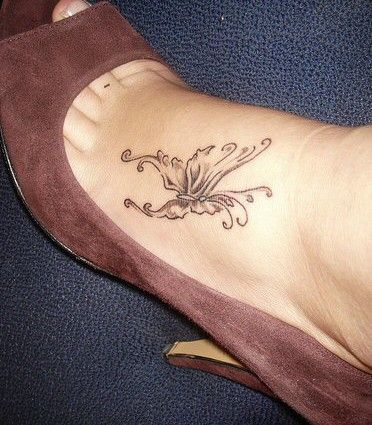 Grey Ink Flower Tattoo On Foot