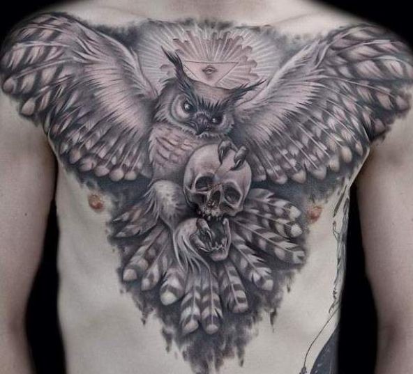 Grey Ink Flying Owl Bird With Skull Tattoo On Man Chest