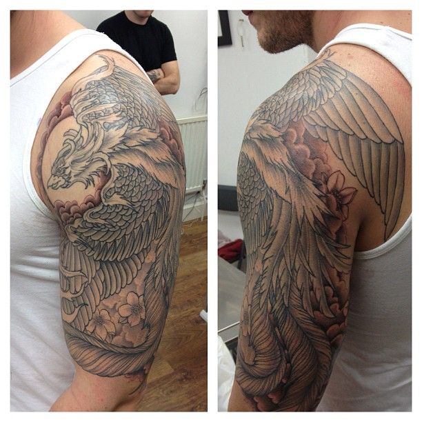 Grey Ink Flying Phoenix Tattoo On Man Left Half Sleeve