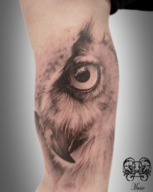 Grey Ink Owl Face Tattoo On Right Bicep