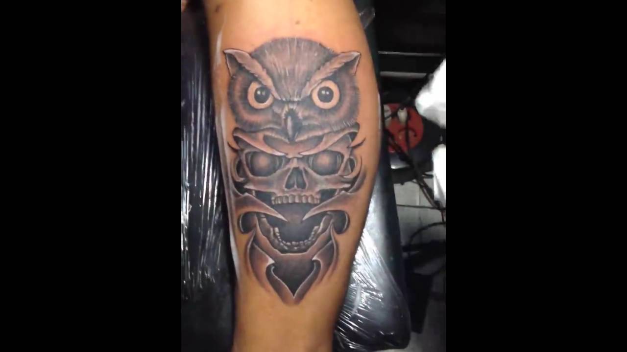 Grey Ink Owl Head With Ripped Skin Skull Tattoo Design For Sleeve