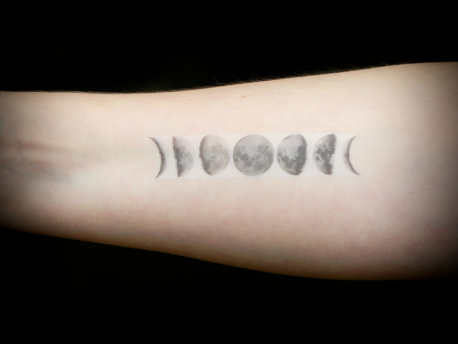 Grey Ink Phases Of The Moon Tattoo On Right Forearm