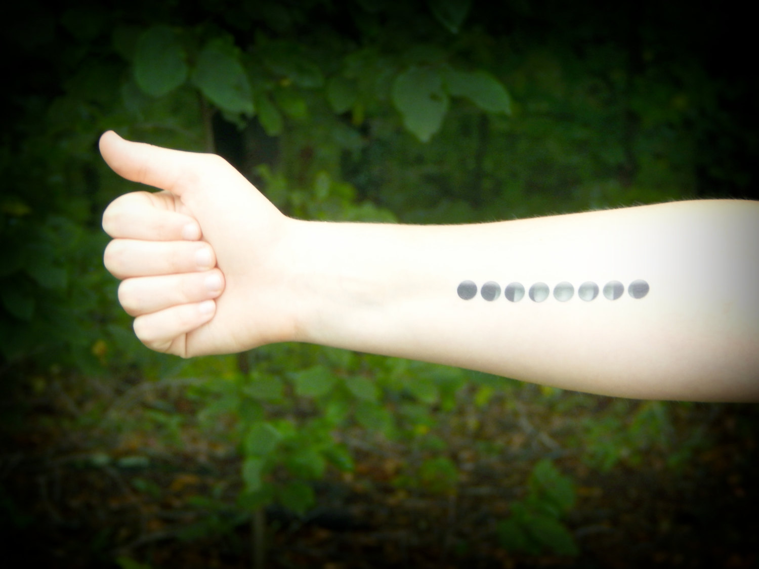 Grey Ink Phases Of The Moon Tattoo On Right Forearm
