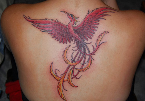 Impressive Flying Phoenix Bird Tattoo On Upper Back