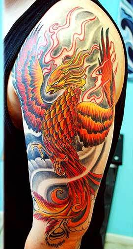Inspiring Colorful Phoenix Tattoo On Man Left Half Sleeve