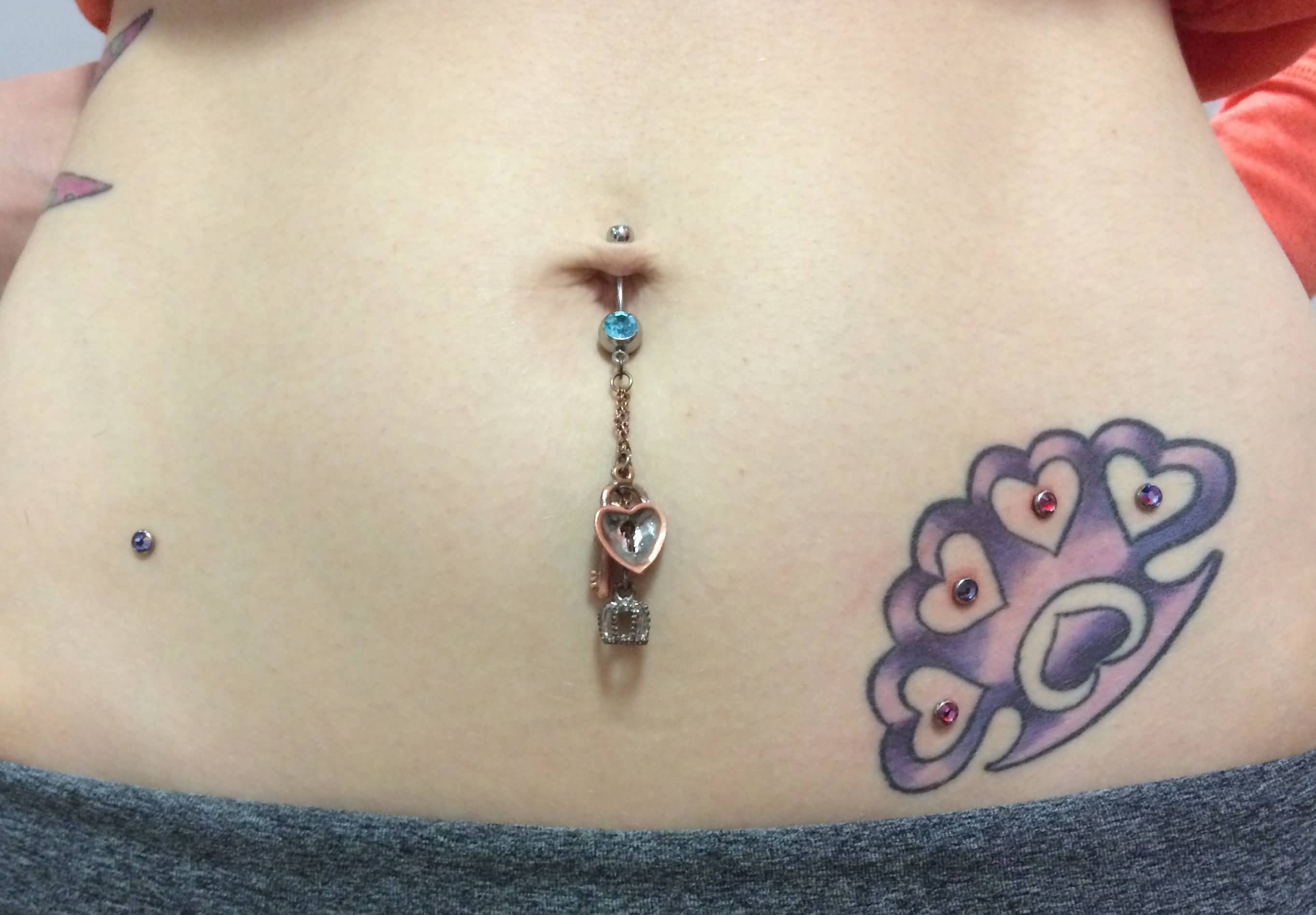 Knuckles Tattoo And Microdermal Hip Piercings Amazing Belly Piercing And Mi...