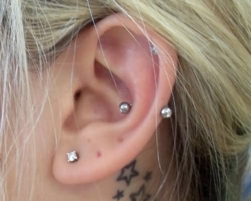 Left Ear Lobe And Snug Piercing For Young Girls