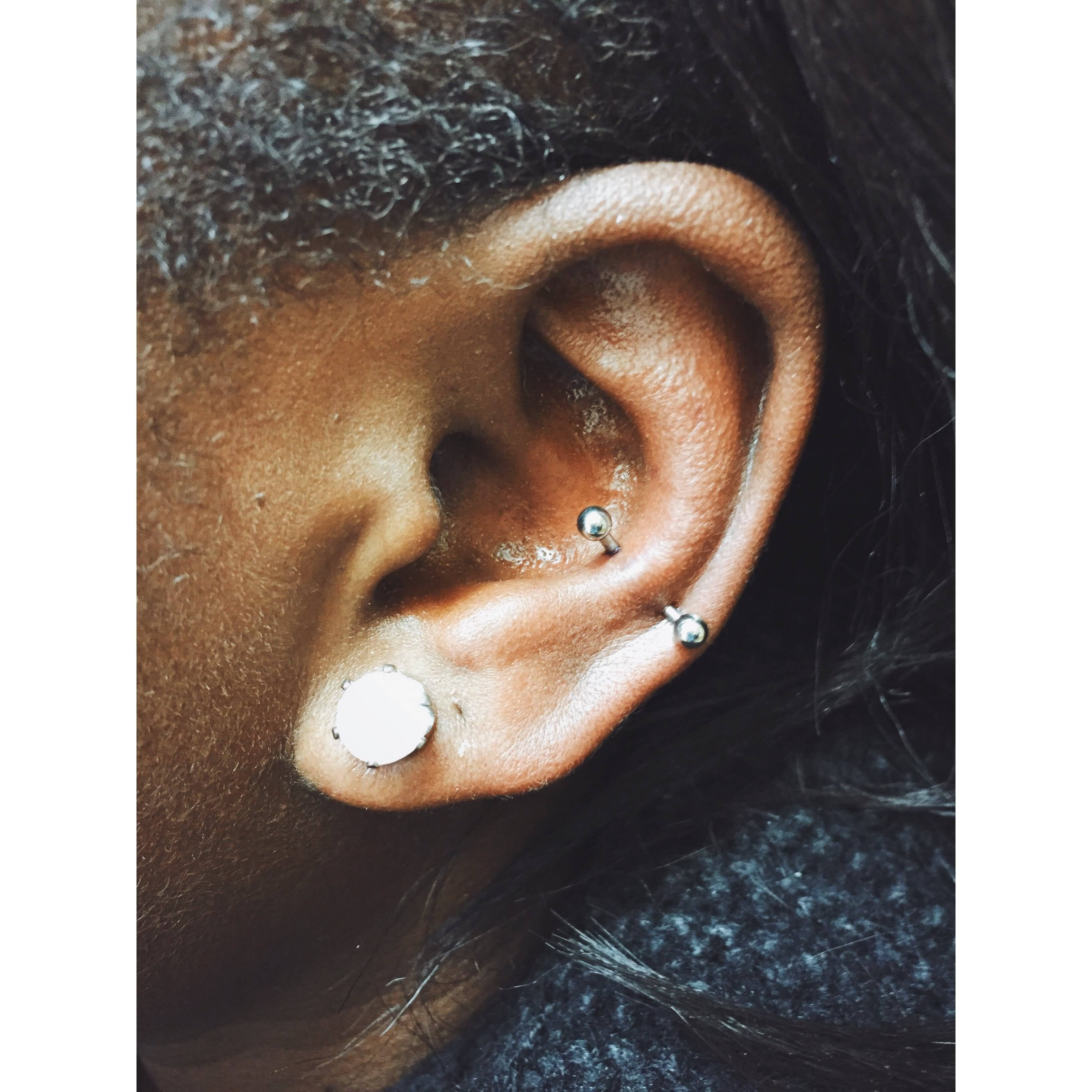 Left Ear Lobes And Silver Barbell Snug Piercing