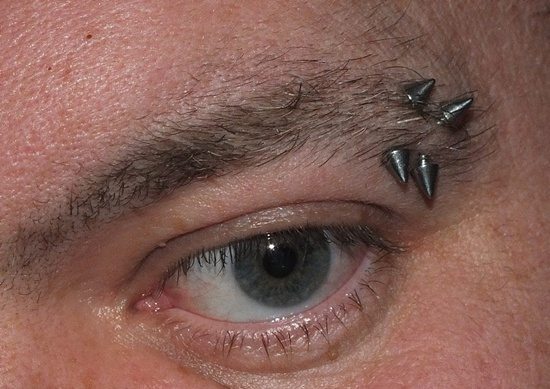 Left Eyebrow Piercings With Spike Barbells