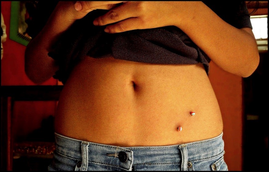 Left Hip Piercing With Colorful Barbell