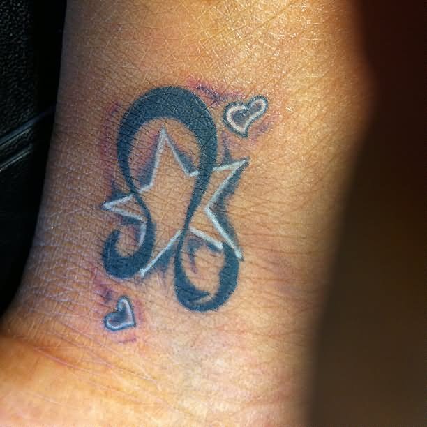 Leo Symbol And Wrist Star Tattoo