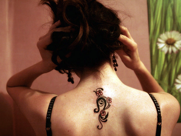 Leo Zodiac Sign With Flowers Tattoo On Girl Upper Back