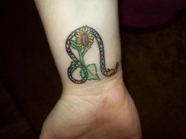 Leo Zodiac Sign With Sunflower Tattoo On Right Wrist
