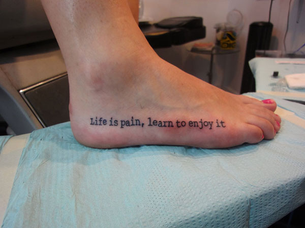 Life Is Pain Learn To Enjoy It Foot Quote Tattoo