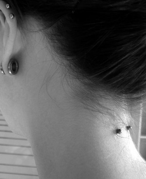 Lobe Stretching And Back Neck Piercing