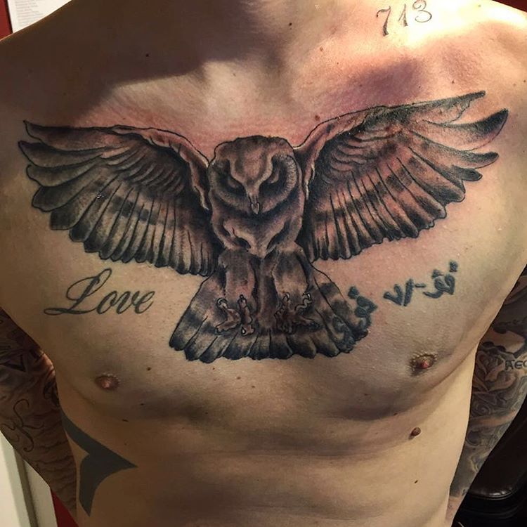 Love - Black Ink Flying Owl Tattoo On Man Chest