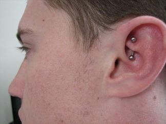 Man With Left Ear Rook Piercing